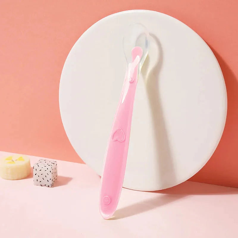 Easy-grip baby feeding spoons in pink, green, blue, yellow — Use Lovy